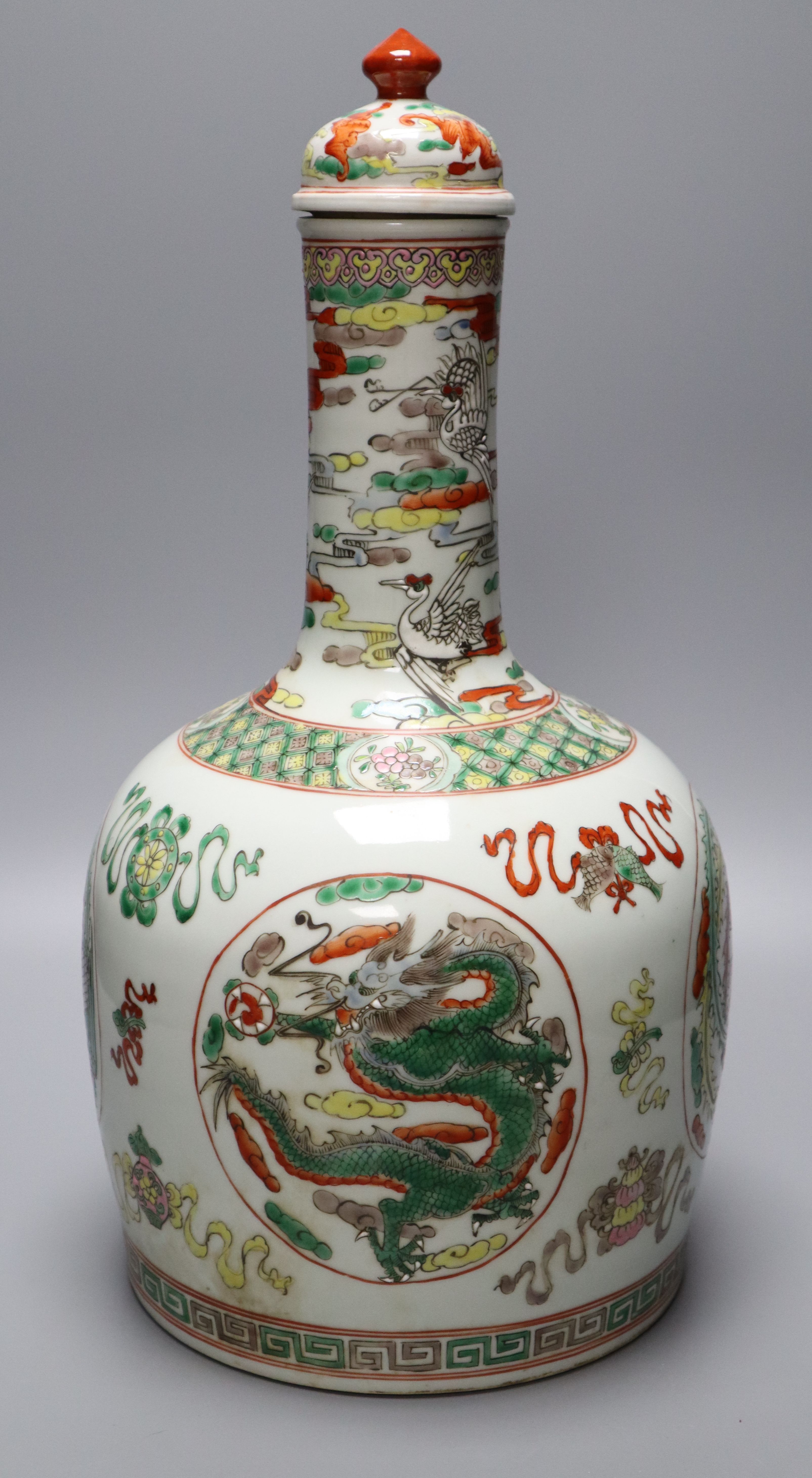 A Chinese famille rose dragon and phoenix bottle vase and cover, 42cm